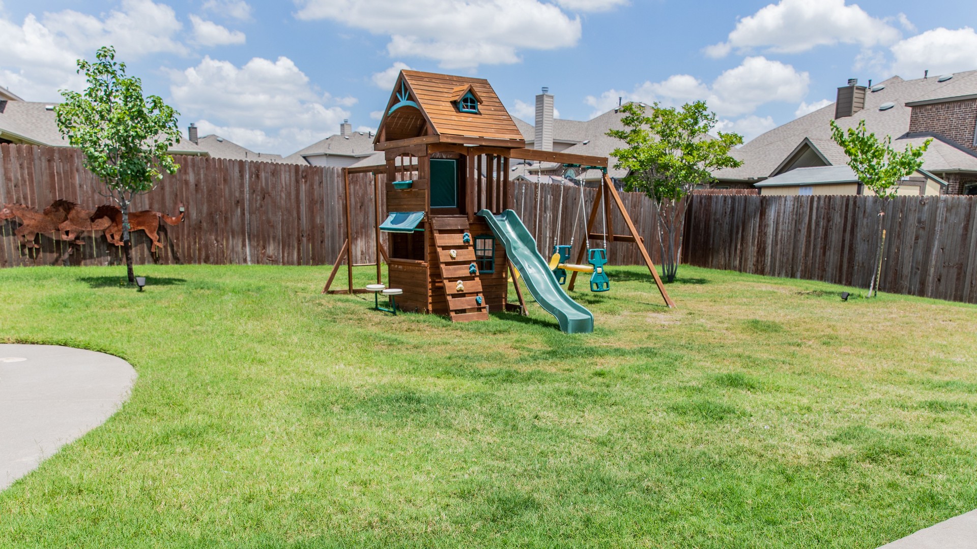 Outdoor play equipment in big backyard